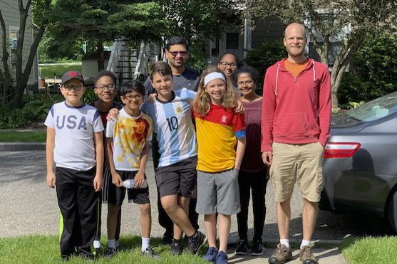 Some of the junior youth, two of the parents, and Bob Schneeweis (right), one of the co-animators for the group do yard work for the Grace Centers of Hope in Pontiac, Michigan, on June 11, 2019. The group has completed two service project in the first yea