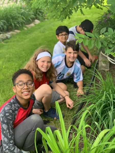 Some of the junior youth that meet in Troy pull weeds for the Grace Centers of Hope in Pontiac, Michigan, on June 11, 2019. The group has met consistently to study together and build friendships, and has completed two service project in the first year of 